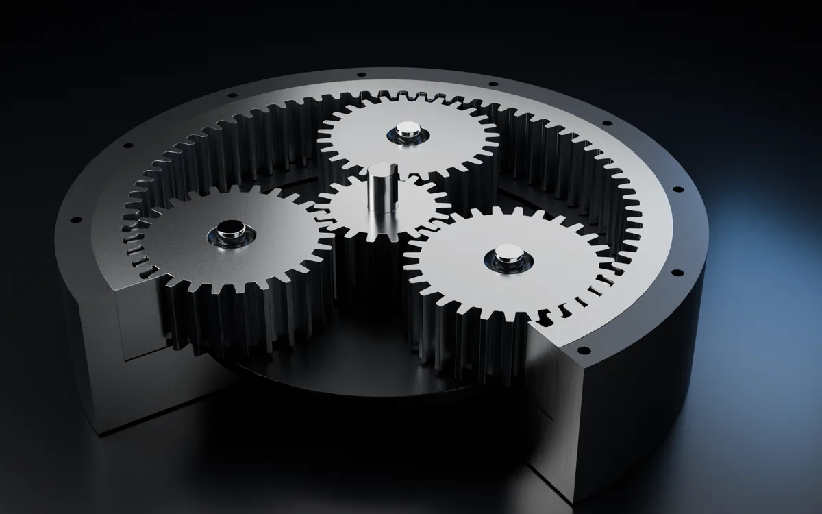 Rendered illustration of a planetary gear stage: a sun gear and three planet gears inside a ring gear, with part of the housing cut away.